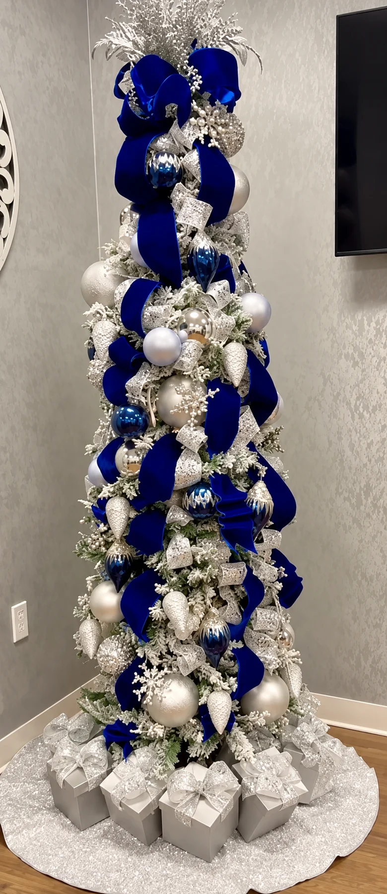 Layered ribbon and warm lights on a statement tree