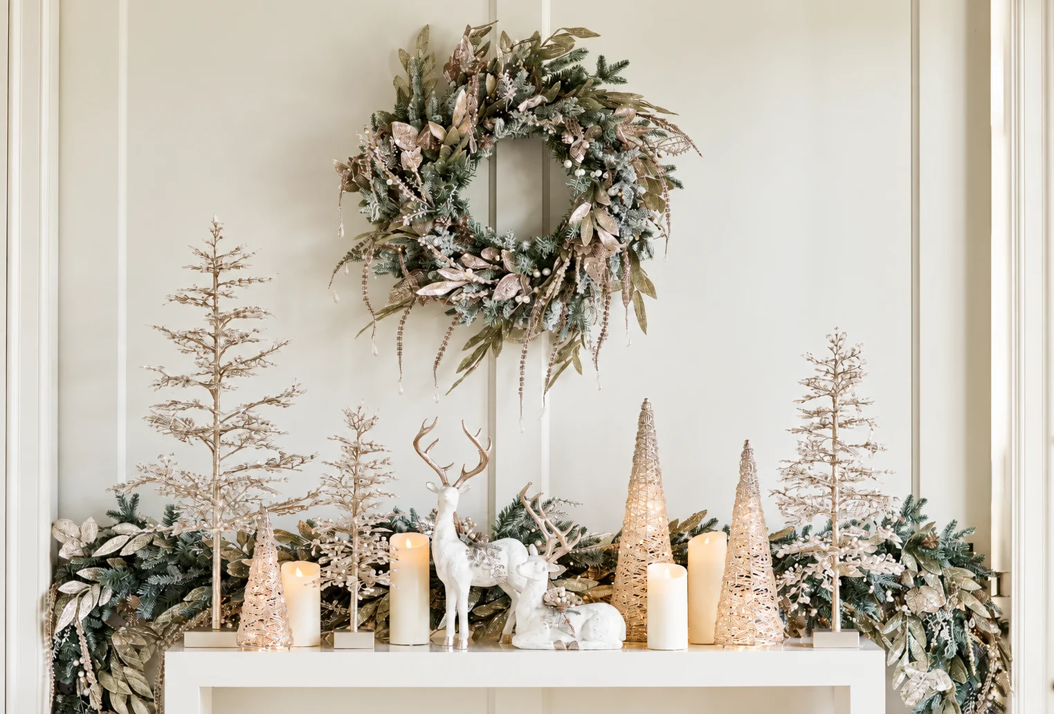 Ivory and gold holiday accents beneath a coordinating wreath